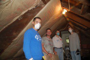 Casey's friends insulating the attic at Francisvale Home for Smaller Animals, 2011