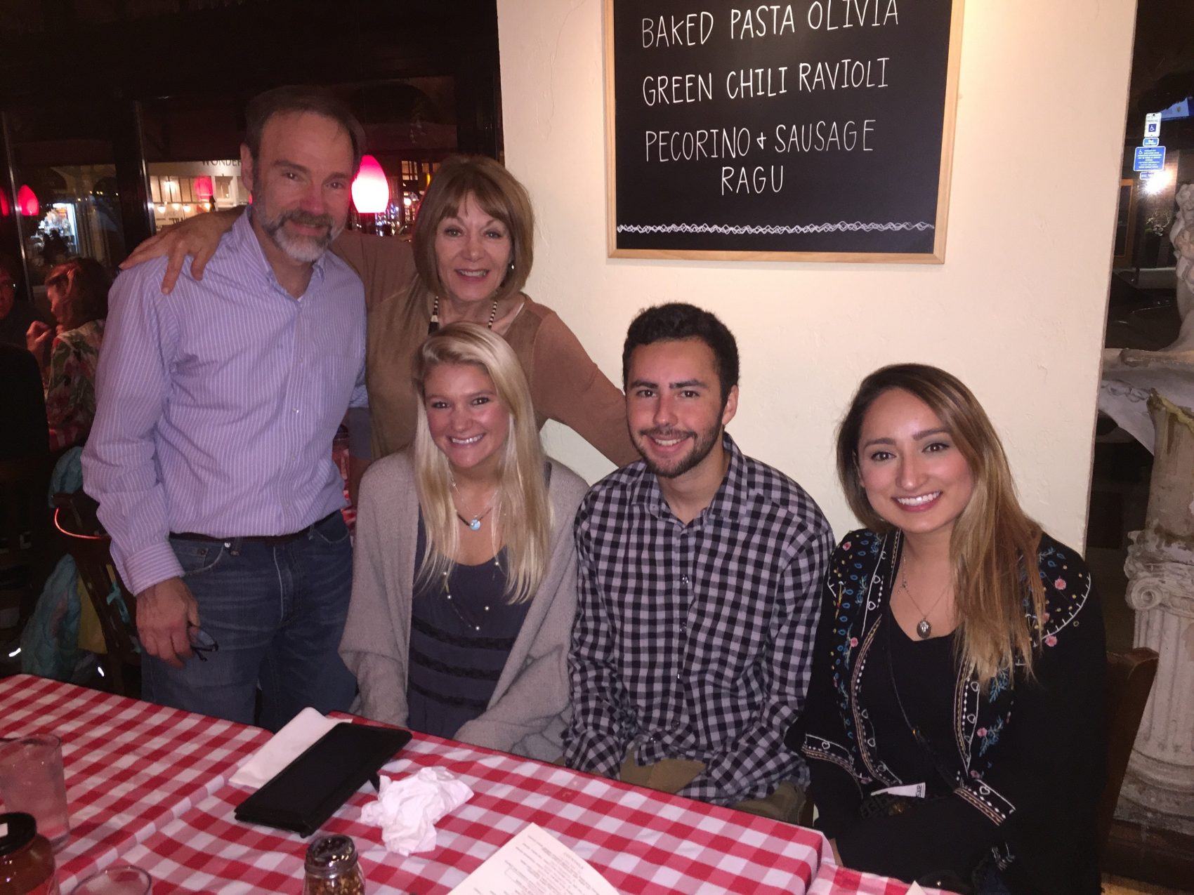 Bryan O'Hagan (seated center) with Casey's parents and Alternative Spring Break scholarship recipients Cynthia Mendoza (R) and Katie Heinen